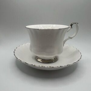 Elegant White Teacup and Saucer with Silver Trim